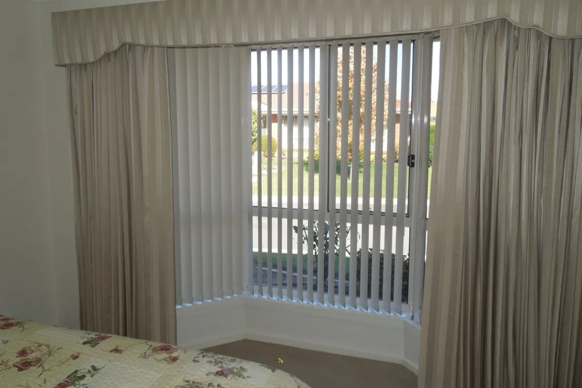 How to Hang Curtains Over Vertical Blinds